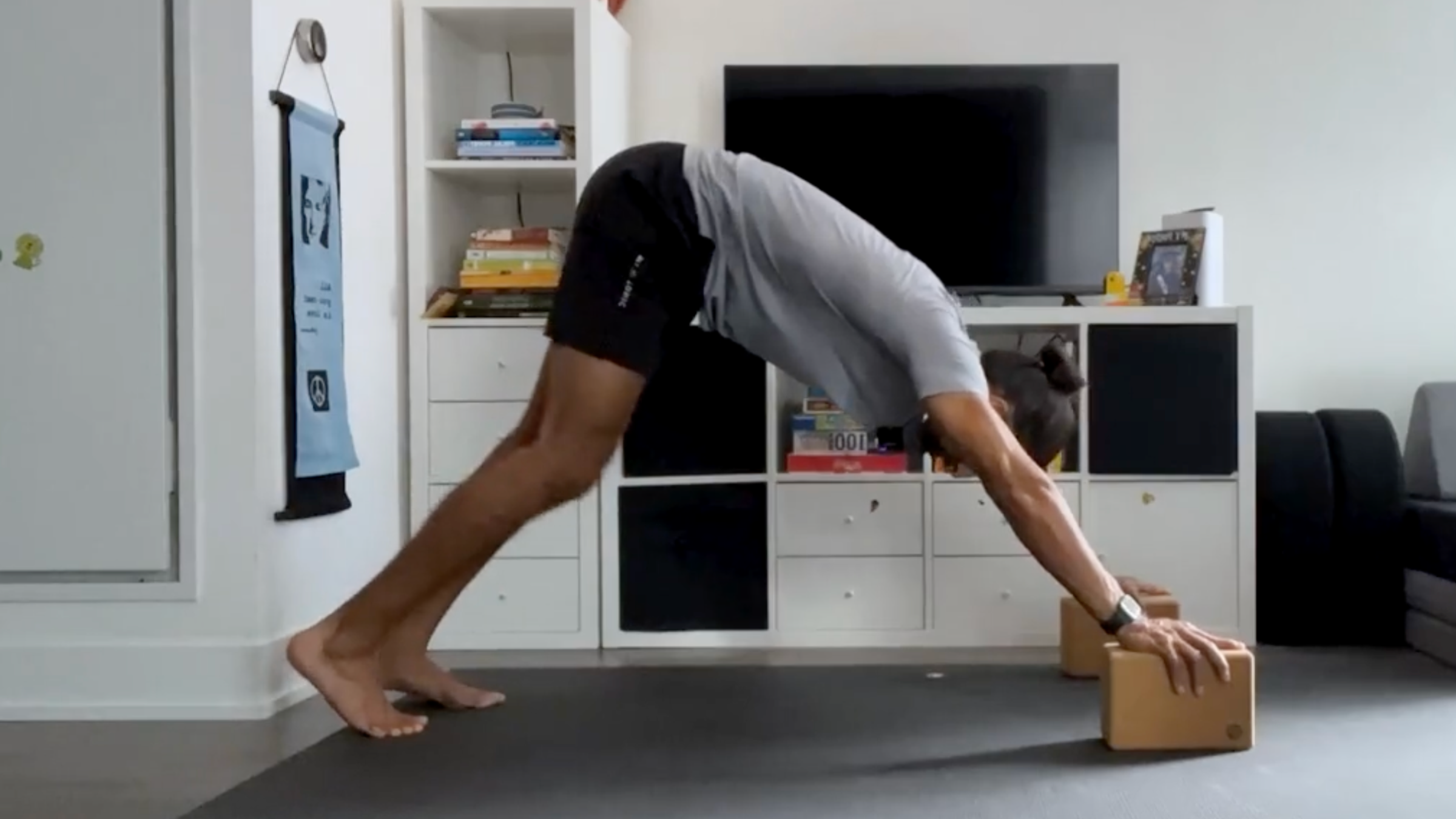 Yoga teacher Jaffer Hussain in Downward-Facing Dog, Adho Mukha Svanasana in Sanskrit